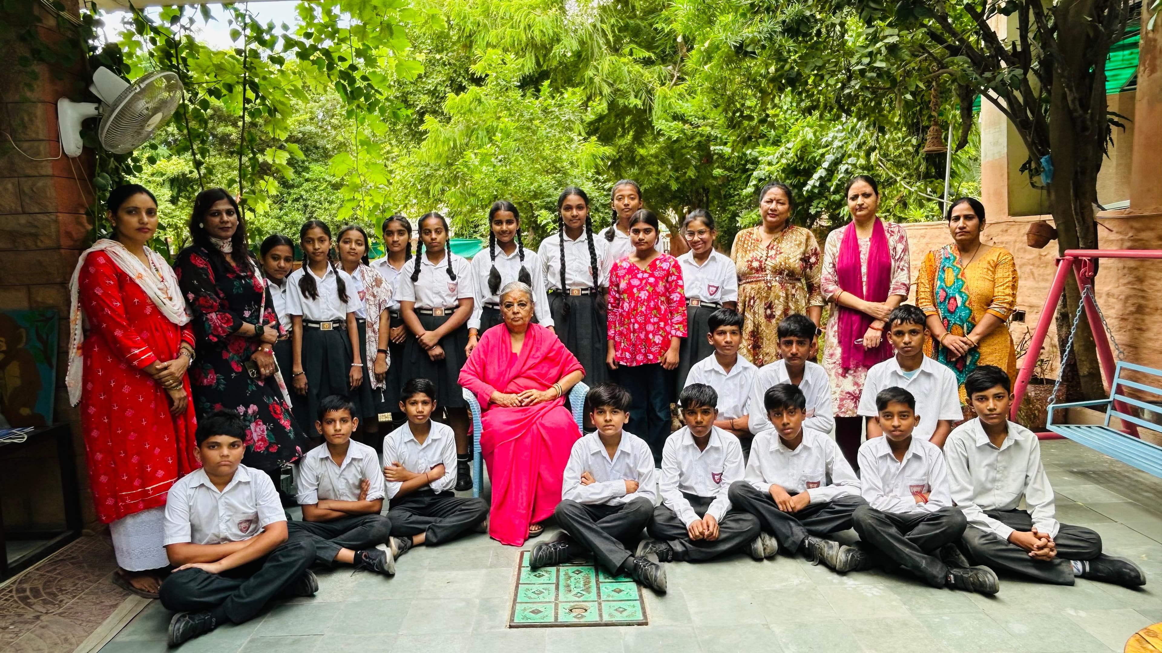 Primary — Class II with teachers in the courtyard